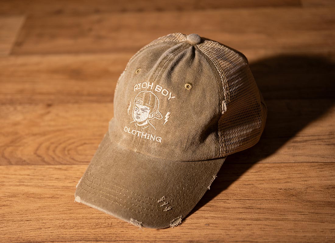 built-different-khaki-washed-trucker-cap